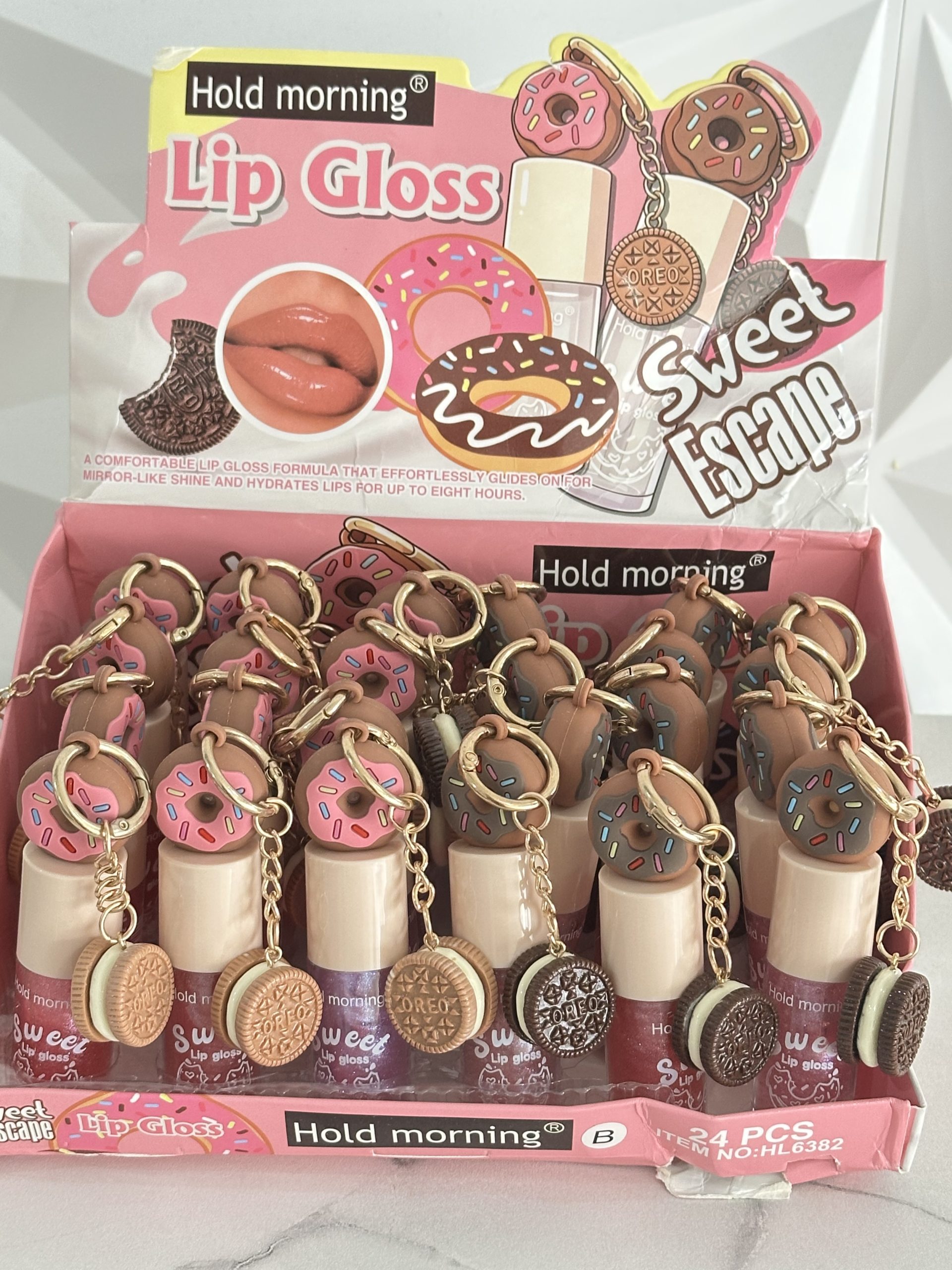LipGloss Donitas llavero Oreo leve tono color brillosito, delicioso aroma ultra jugosos, humectan e hidratan.