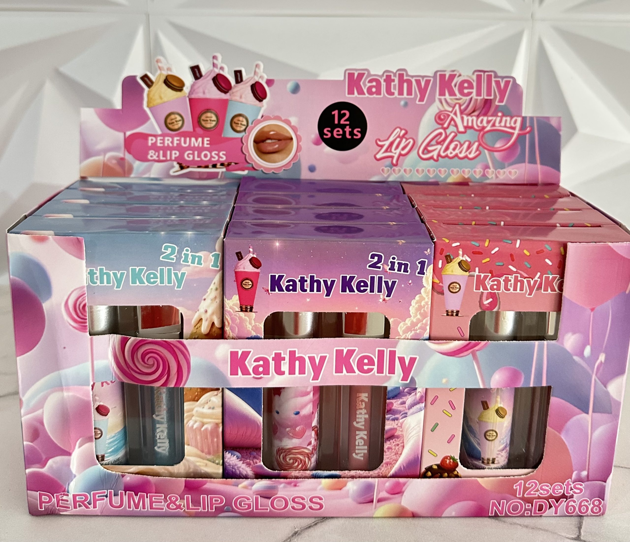 Caja con 12 Duos PERFUME + LIP GLOSS Yum Yum. Kathy Kelly